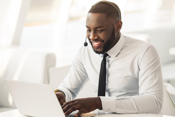 Male business student in front of a computer.